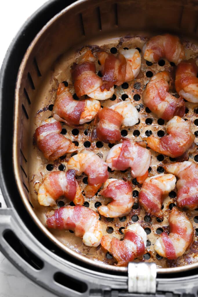 bacon wrapped shrimp in air fryer basket once done cooking