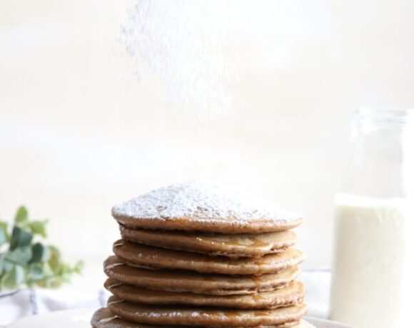 pancakes with powdered sugar topping on top