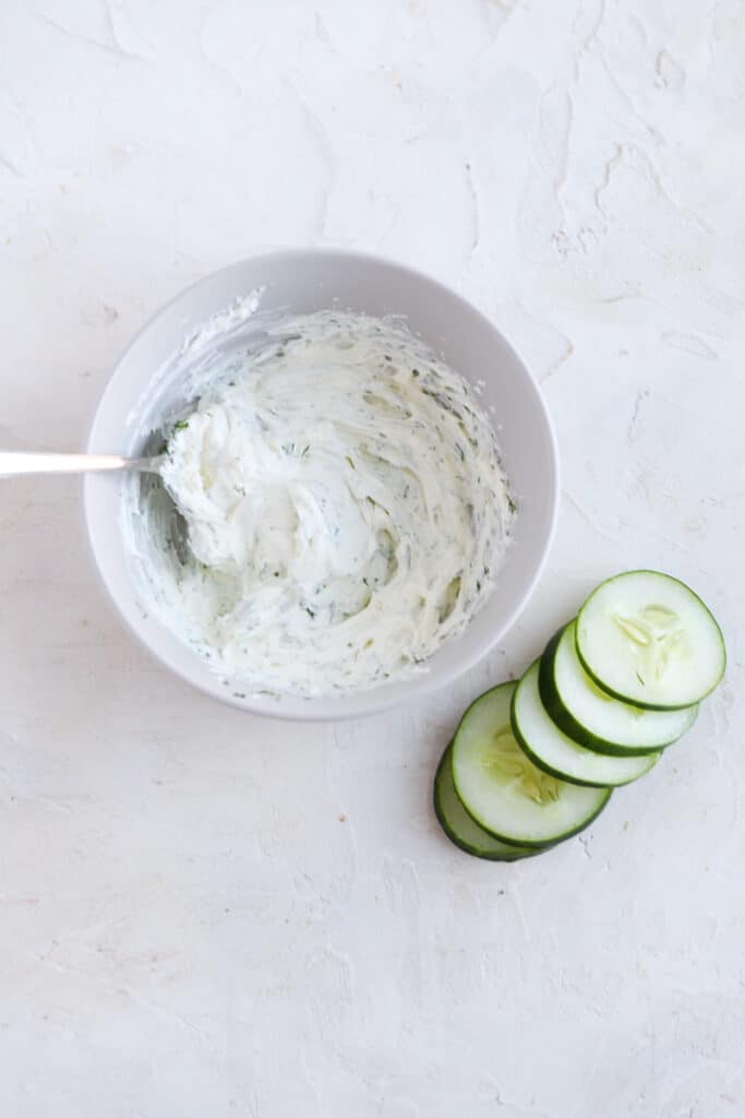 mix dill with cream cheese to prep the cucumber cream cheese sandwiches
