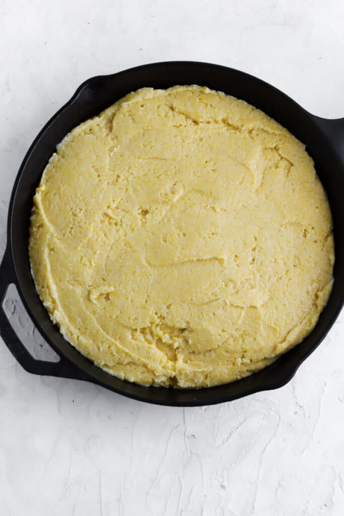 add the corn bread batter to a cast iron and bake