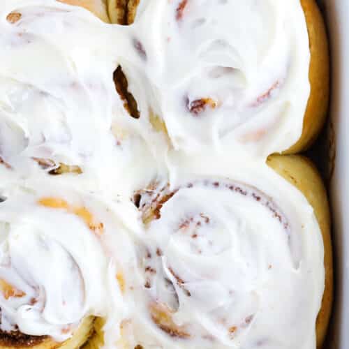 cinnamon roll with icing close up