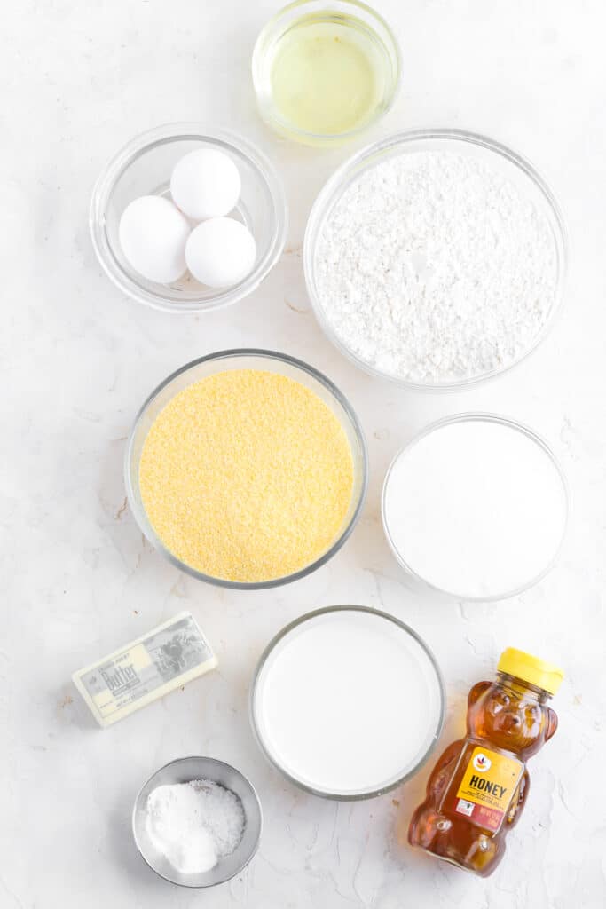 ingredients to make corn bread in a cast iron skillet