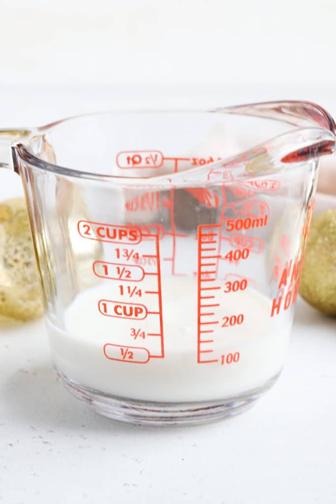 add whole milk to a measuring cup