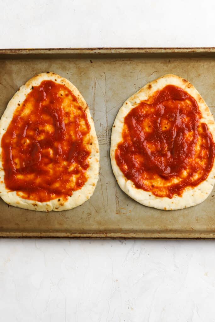 spread pizza sauce on the flatbread